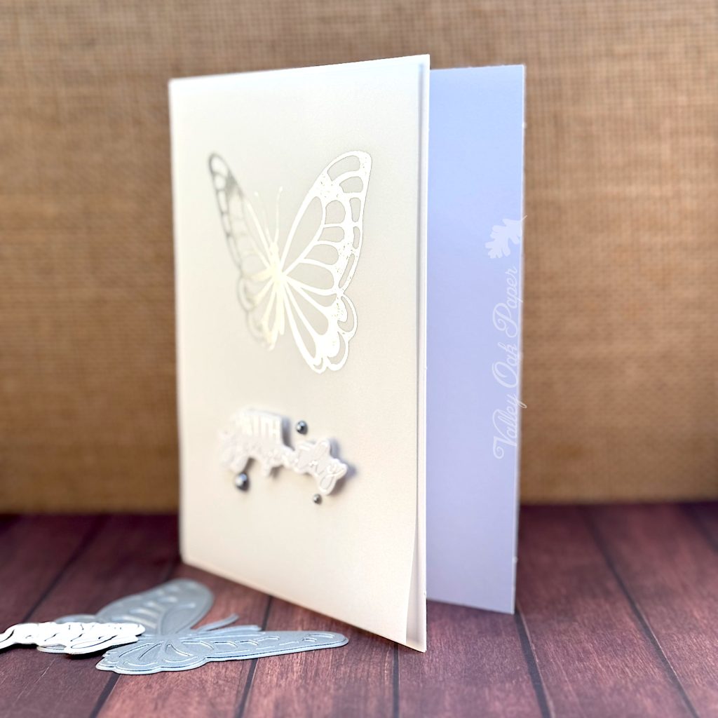 Greeting card showing the greeting "With Sympathy" and a large butterfly.