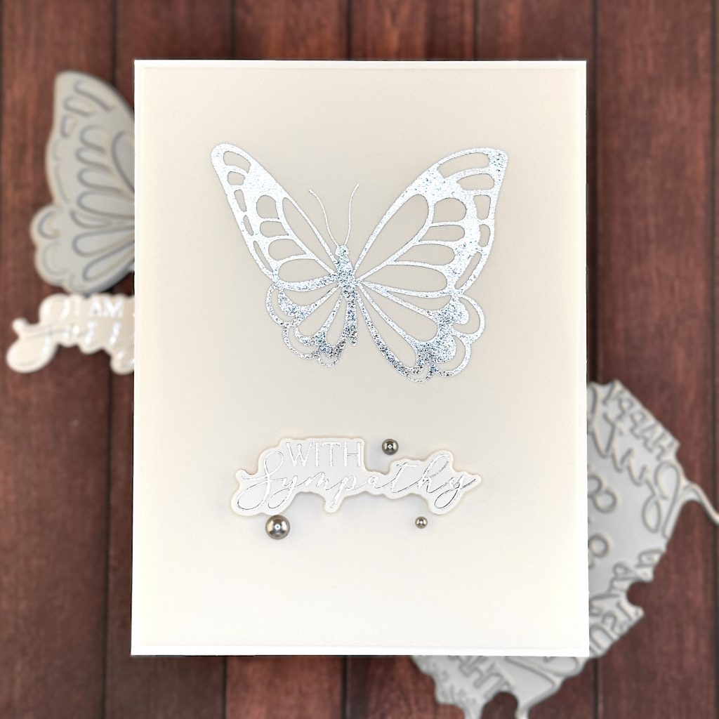 Greeting card showing the greeting "With Sympathy" and a large butterfly.