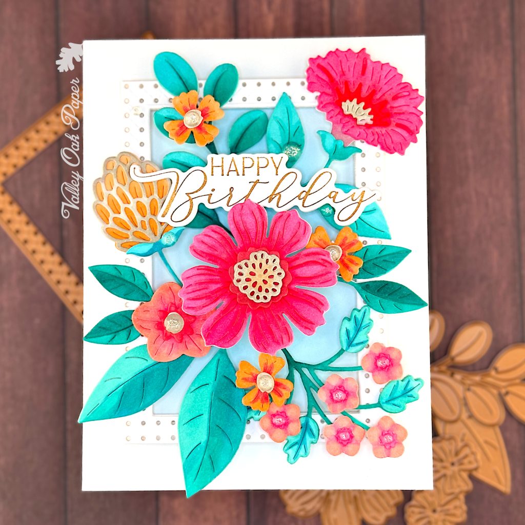 Greeting card dominated by die cut flowers in pink and orange. The greeting reads Happy Birthday.