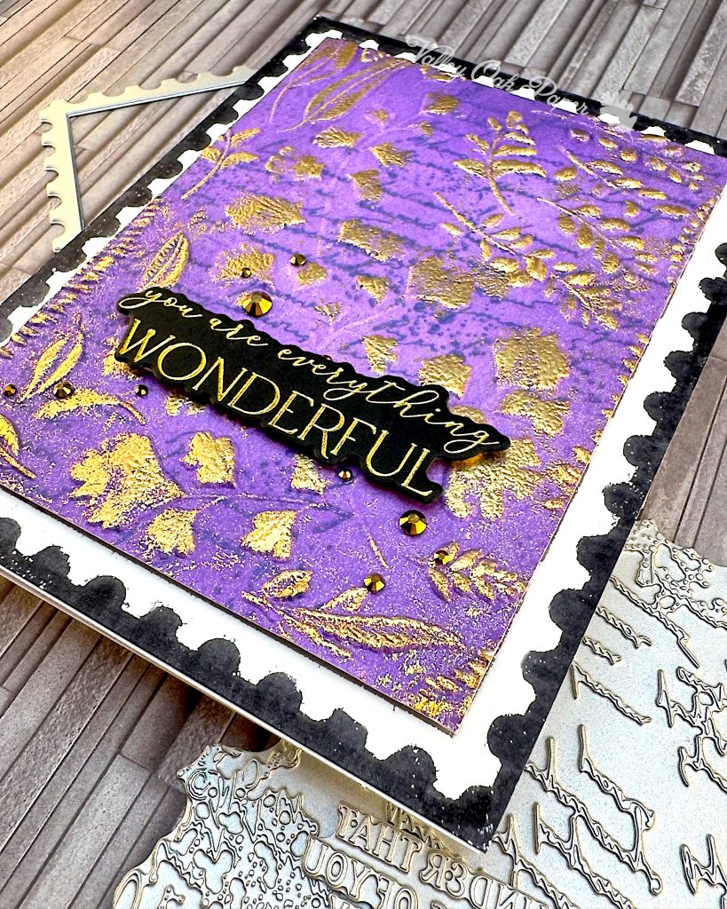 Black greeting card with a purple postage stamp taking up most of the space. The greeting reads "You are everything wonderful." Under the card are some BetterPress plates that were used in its making.